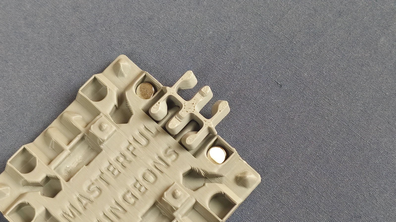 Tile underside with both magnets and clips installed