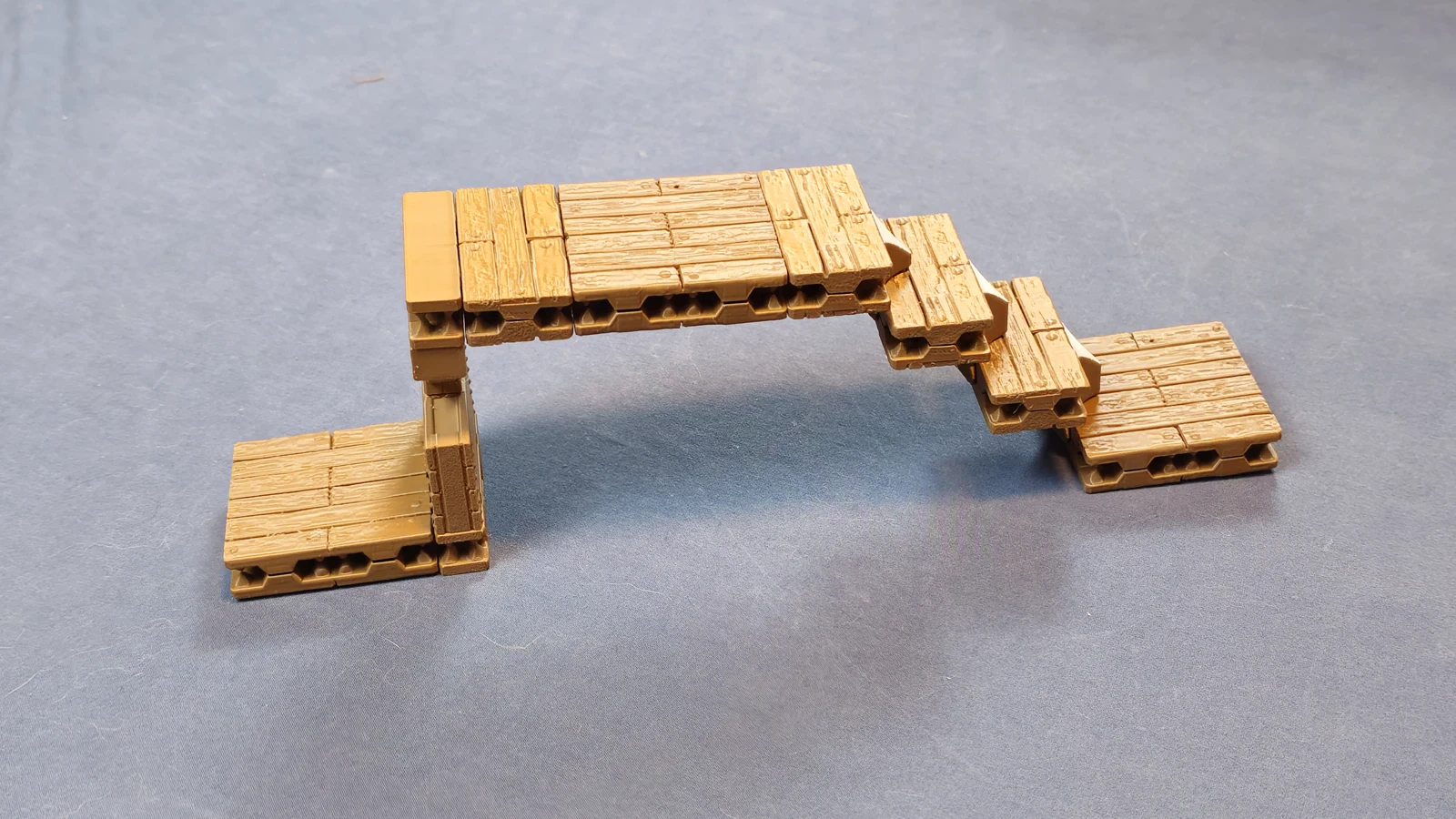 Raised wooden platform connected to a lower floor by steps