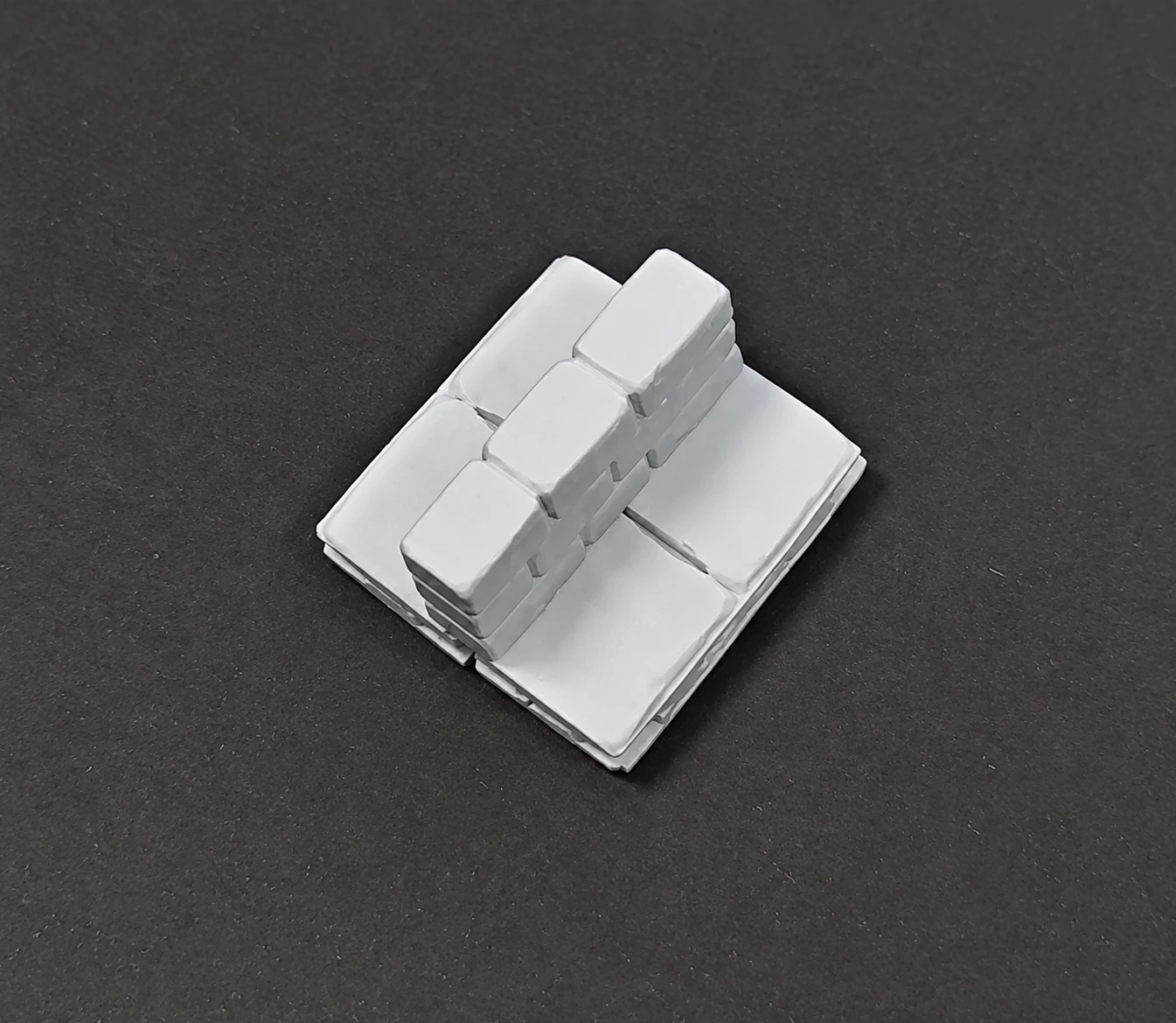 Position a wall across the seam between floor pieces.